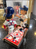 The Boston Red Sox MLB Jason Varitek & Curt Schilling Duel Ticket Base Bobblehead is a limited edition collectible commemorating