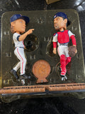 The Boston Red Sox MLB Jason Varitek & Curt Schilling Duel Ticket Base Bobblehead is a limited edition collectible commemorating