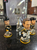 The Boston Bruins 2001 Stanley Cup Champions Mini Bobblehead Set is a collectible item featuring the team members Chara and Thomas and Lucic