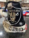 Raiders NFL team logo plush holiday Santa hat swirl design foco