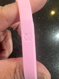 Dallas Cowboys NFL Team Logo Adult Women's Pink Wristband Mylar Bracelet is a stylish and feminine accessory for female fans of the iconic football team.