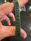 Boston Red Sox MLB Adult Mylar Wristbands Bracelets 3pk is a set of three wristbands featuring the iconic Boston Red Sox team logo and colors. Officially licensed by Major League Baseball (MLB)
