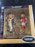 The Boston Red Sox MLB Jason Varitek & Curt Schilling Duel Ticket Base Bobblehead is a limited edition collectible commemorating