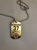 Boston Bruins NHL former team captain Patrice Bergeron metal dog tag necklace with engraved signature.