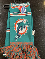 Miami Dolphins with this 65-inch plush team logo scarf. This two-sided scarf features the vibrant team color and the official NFL team logo