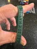 Boston Red Sox MLB Adult Mylar Wristbands Bracelets 3pk is a set of three wristbands featuring the iconic Boston Red Sox team logo and colors. Officially licensed by Major League Baseball (MLB)