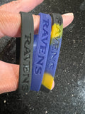 three adult-sized wristbands featuring the Baltimore Ravens NFL team logo, designed by Forever Collectibles for fans of the National Football League