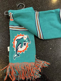 Miami Dolphins with this 65-inch plush team logo scarf. This two-sided scarf features the vibrant team color and the official NFL team logo