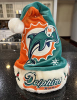 Miami Dolphins Adult NFL plush NFL big logo holiday swirl Santa hat by Foco Show off your team spirit with this festive accessory