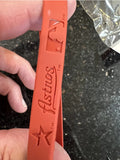 Houston Astros adult silicone MLB logo wristband.

New in original package.