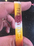 The Washington Redskins Adult Mylar NFL Team Logo + Color 3pk Wristbands Bracelet is a set of three wristbands featuring the iconic team logo and colors of the Washington Commanders.
