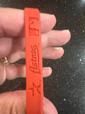 set of three mylar wristbands bracelets featuring the logo of the Houston Astros, a Major League Baseball team. Made by Forever Collectibles