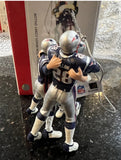 New England Patriots rare retro team celebration Xmas ornament featuring Tom Brady and Tedy Bruschi.
