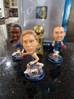 mini bobblehead set featuring Dirk Nowitzki of the Dallas Mavericks, a team that won the NBA championship in 2011.