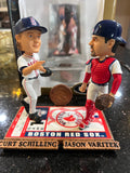 The Boston Red Sox MLB Jason Varitek & Curt Schilling Duel Ticket Base Bobblehead is a limited edition collectible commemorating