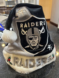 Raiders NFL team logo plush holiday Santa hat swirl design foco