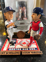 The Boston Red Sox MLB Jason Varitek & Curt Schilling Duel Ticket Base Bobblehead is a limited edition collectible commemorating
