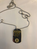 Boston Bruins NHL former team captain Patrice Bergeron metal dog tag necklace with engraved signature.