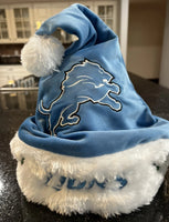 Detroit Lions NFL big logo plush Solid Blue santa hat for adults. Perfect for fans of the National Football League (NFL)