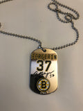 Boston Bruins NHL former team captain Patrice Bergeron metal dog tag necklace with engraved signature.