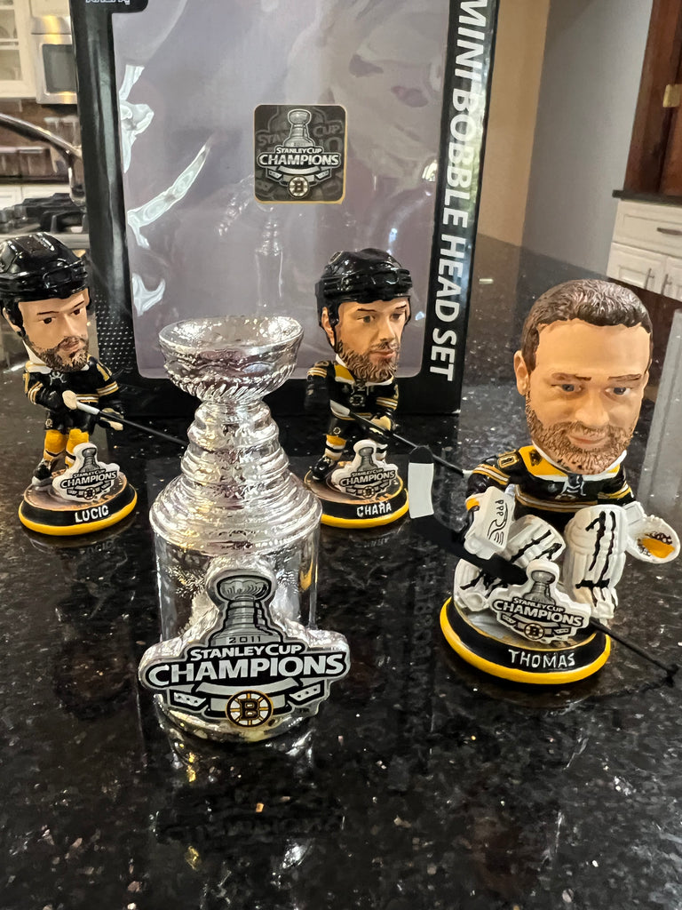 The Boston Bruins 2001 Stanley Cup Champions Mini Bobblehead Set is a collectible item featuring the team members Chara and Thomas and Lucic
