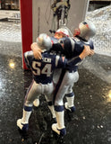 New England Patriots rare retro team celebration Xmas ornament featuring Tom Brady and Tedy Bruschi.