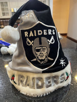 Raiders NFL team logo plush holiday Santa hat swirl design foco