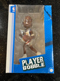 The product is a rare action bobblehead of Amar'e Stoudemire, a former player for the New York Knicks in the NBA. This is an officially licensed collectible by Forever Collectibles