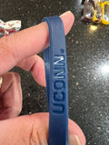 UConn Huskies NCAA Team Adult Mylar Team Color and Logo Wristbands 3 Pack is a set of wristbands perfect for any fan of the basketball team.