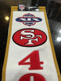 San Francisco 49ers beautifully crafted NFL Super Bowl 19 Heritage Banner. Made with embroidered wool and measuring 8" x 32"